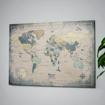 Muted vintage world map canvas on a gray wall, angled view with a plant leaf at the right