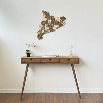 Catalonia wooden map above a slim drawer console, wide view with white baseboard