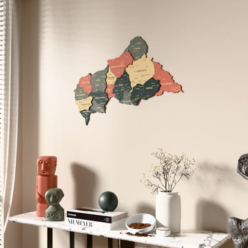 Sage Central African Republic wooden wall map beside a sheer curtain, angled view