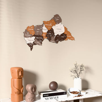 Soil Central African Republic wooden wall map on a beige wall above a console with figurines