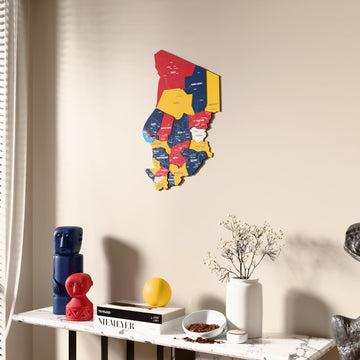 Flag colored Chad wooden wall map beside a sheer curtain, angled view