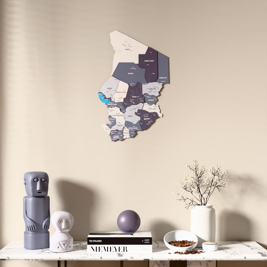 Nimbus Chad wooden wall map above a marble console, front view