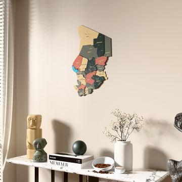 Sage Chad wooden wall map beside a sheer curtain, angled view