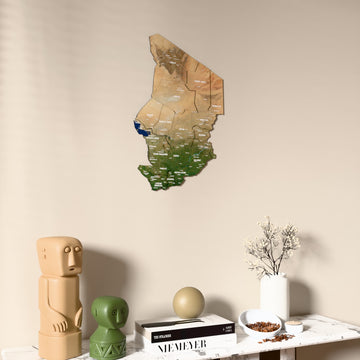 Satellite Chad wooden wall map on a beige wall above a console with figurines