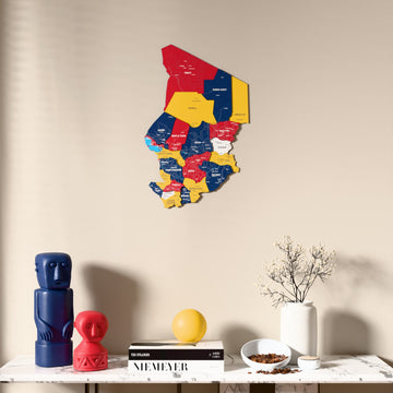 Flag colored Chad wooden wall map above a marble console, front view