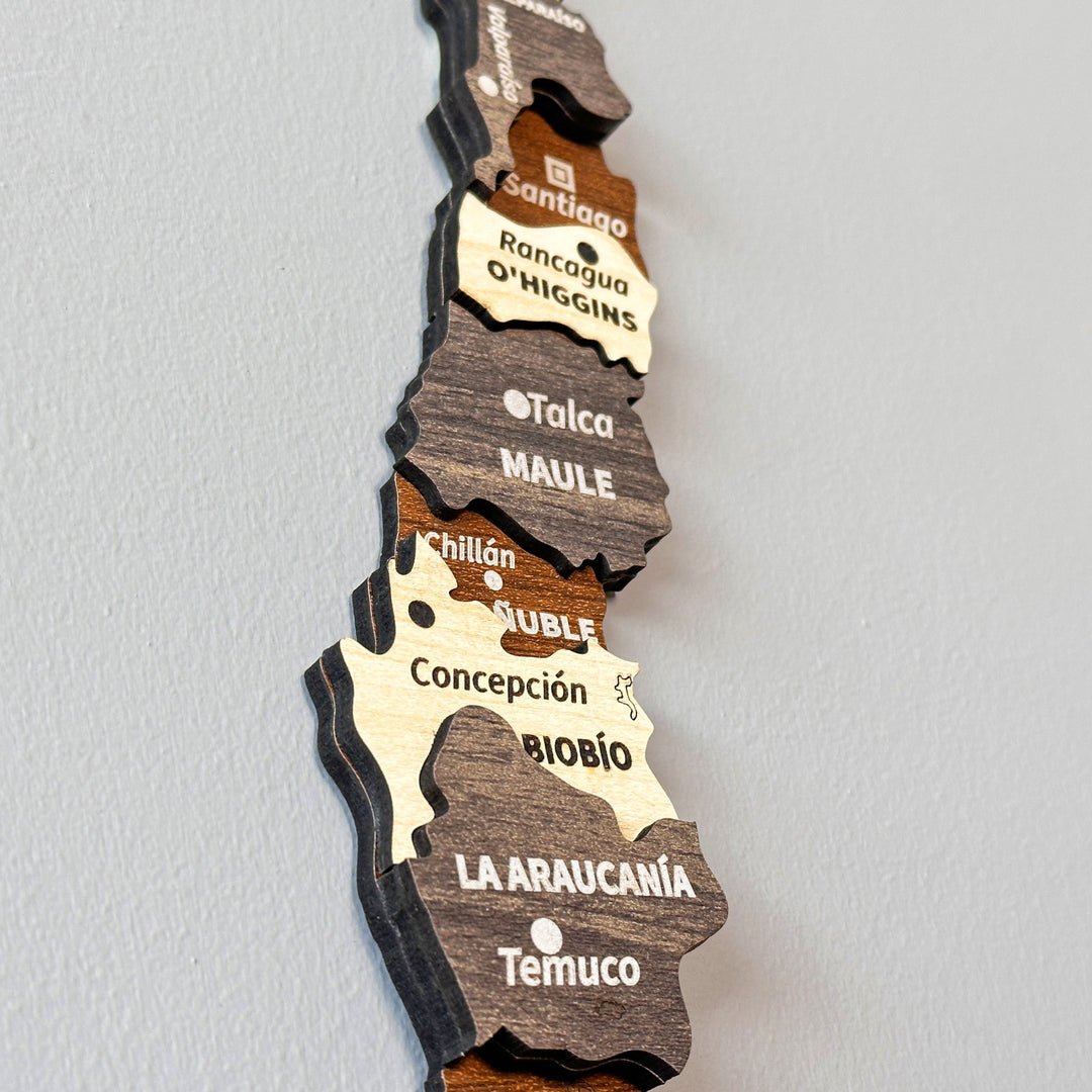 Close-up of the Santiago, Maule, Biobío and La Araucanía layers on the wooden Chile map