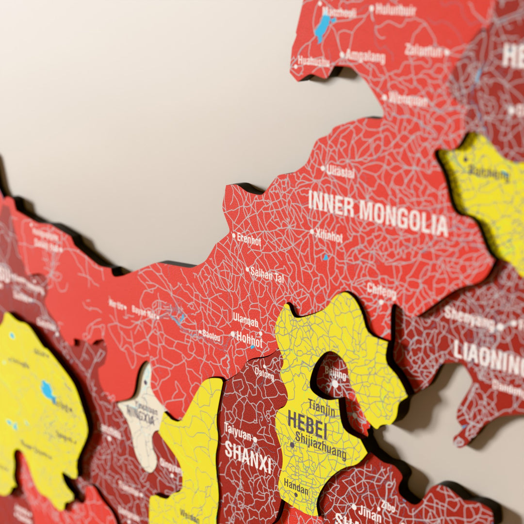 Close-up of the Flag colored China wooden wall map with layered regions and printed names