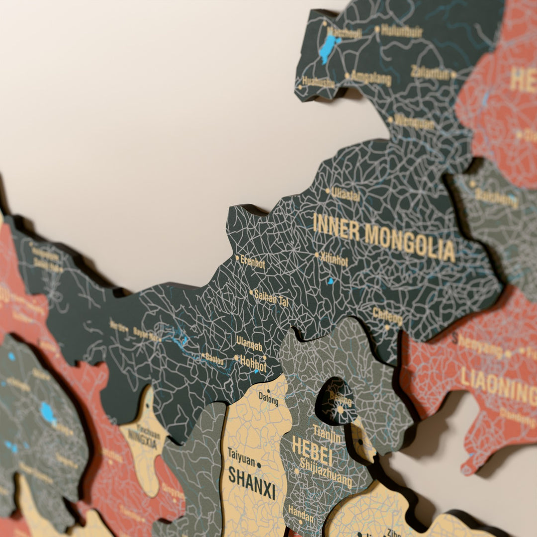 Close-up of the Sage China wooden wall map with layered regions and printed names