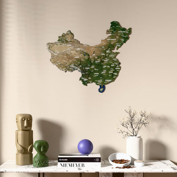 Satellite China wooden wall map above a marble console, front view