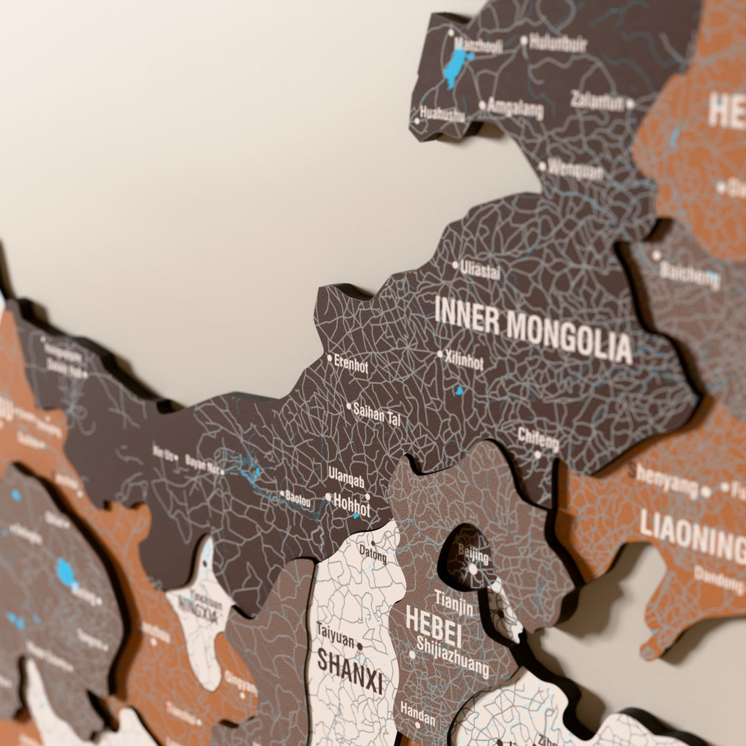 Close-up of the Soil China wooden wall map with layered regions and printed names