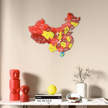 Flag colored China wooden wall map above a marble console, front view