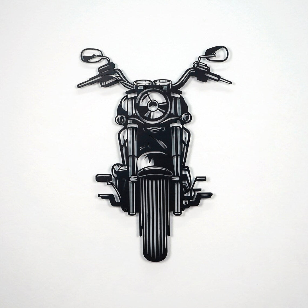 Black chopper motorcycle metal wall art on a white wall, front view