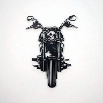 Black chopper motorcycle metal wall art on a white wall, front view