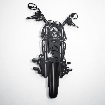 Black chopper motorcycle metal wall art at a slight angle with layered shadow