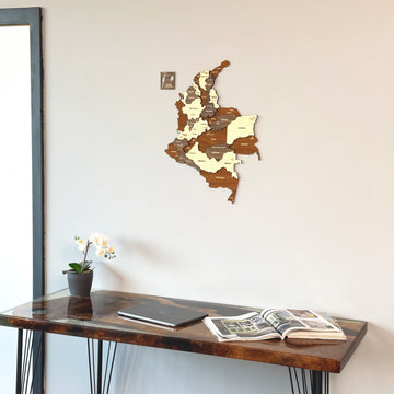 Colombia wooden wall map with city names above a glossy resin desk, wide view