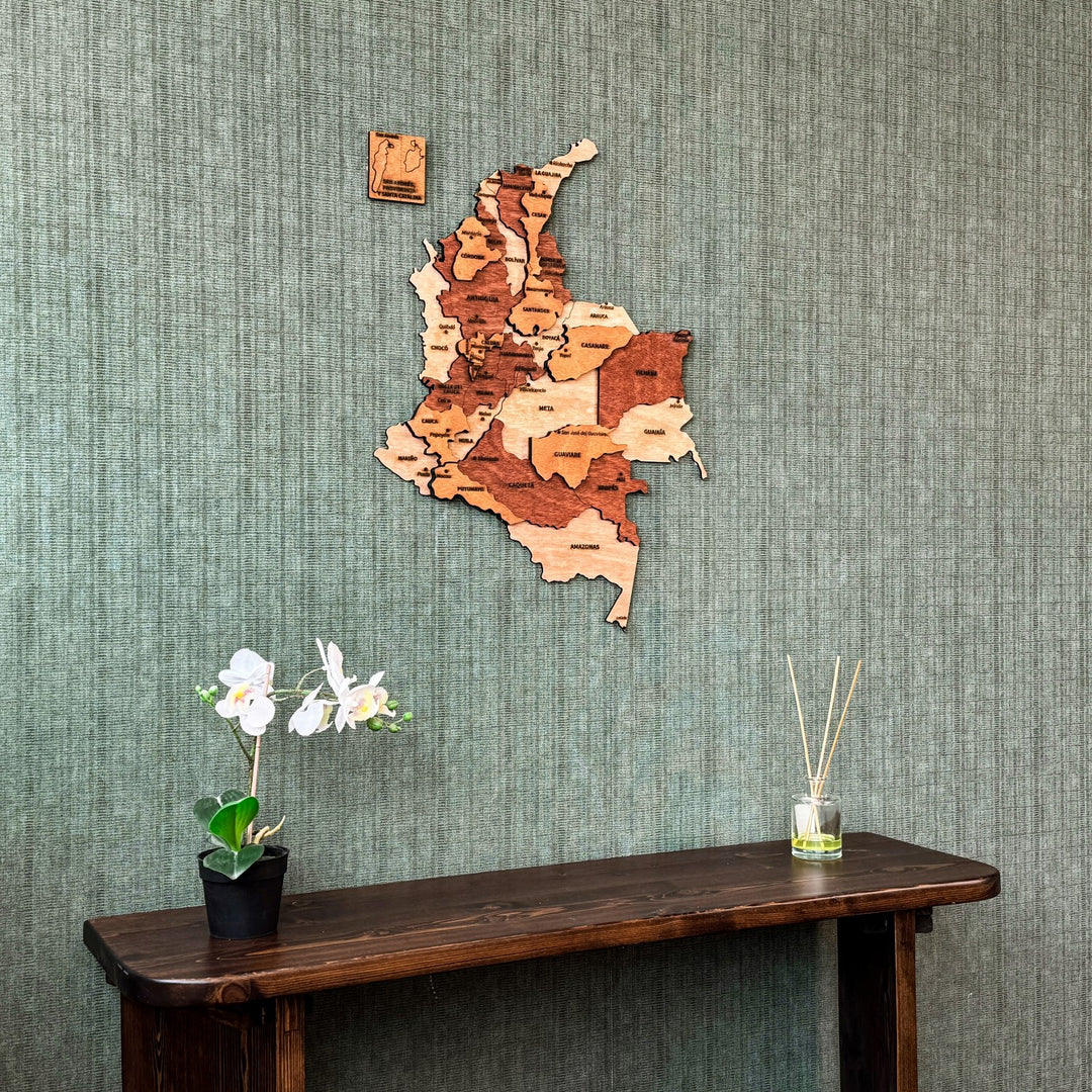 Colombia plywood wall map above a dark console with an orchid, centered view