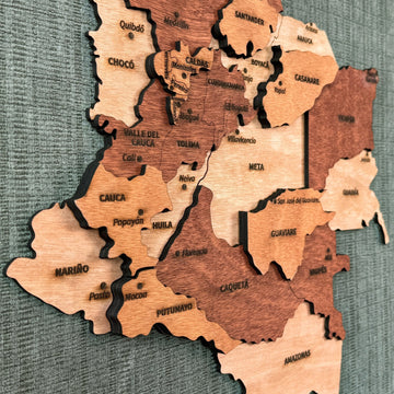 Close-up angled view of Chocó, Valle del Cauca, Cauca and Meta on the wooden Colombia map