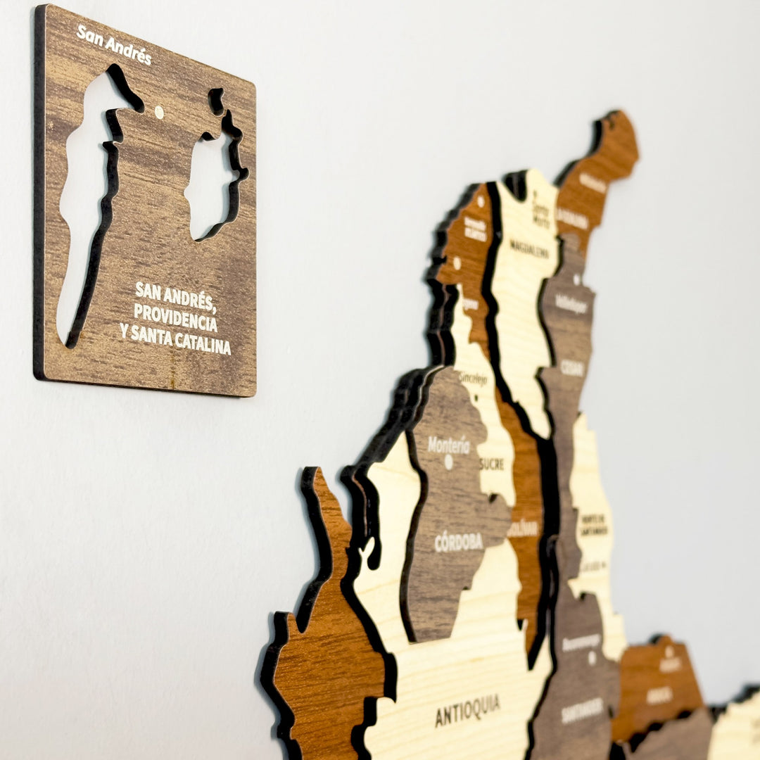 Side-angle close-up of the Colombia wooden map with the San Andrés, Providencia plaque and Antioquia and Córdoba layers