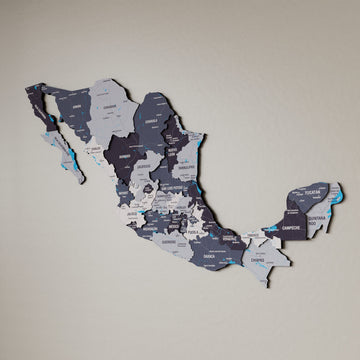 Nimbus Mexico wooden wall map in slate gray and purple tones on a beige wall, angled view showing the layered pieces