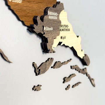 Close-up of Croatia wooden map layers showing Šibenik, Split and Adriatic island pieces in brown and cream