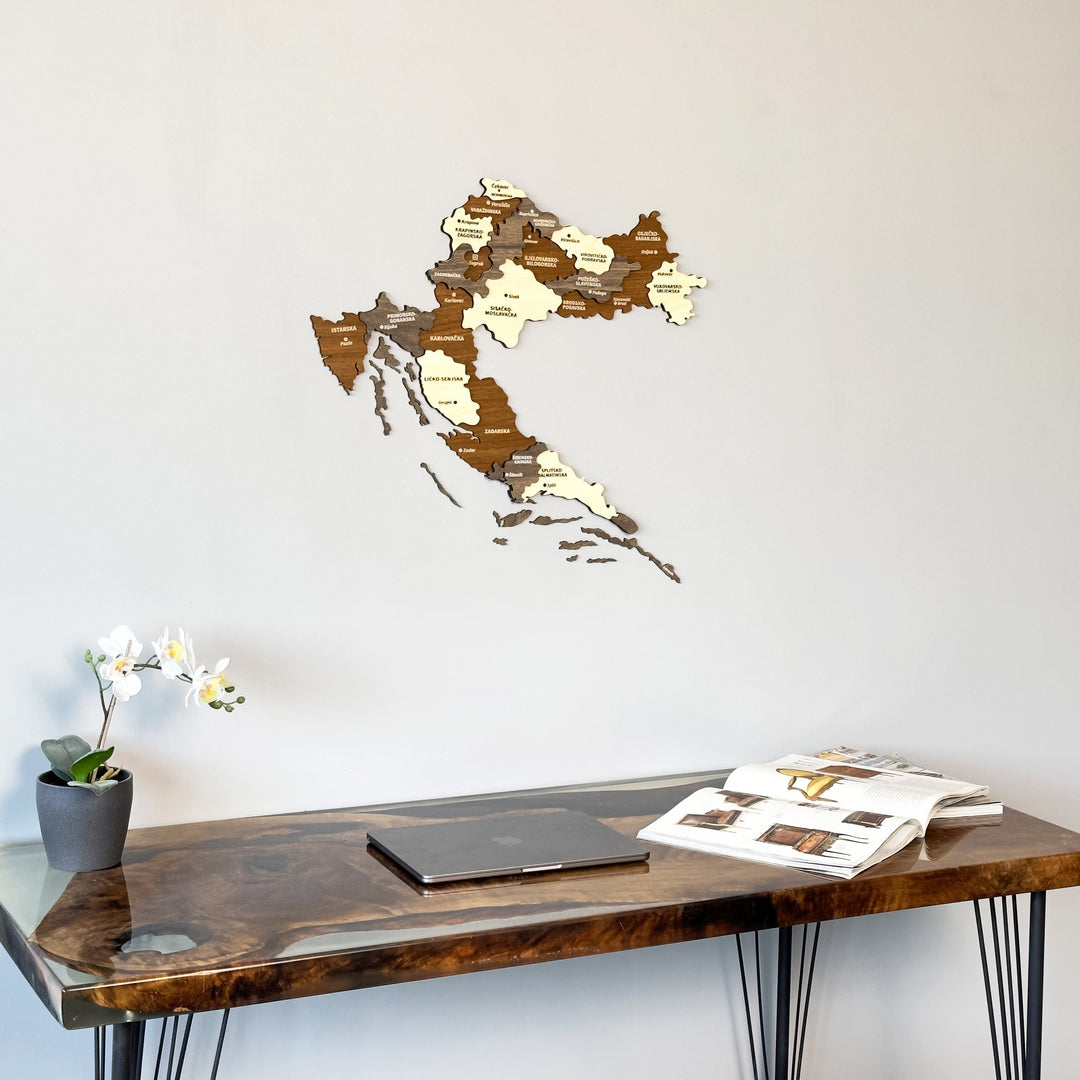 Closer view of the Croatia wooden wall map with layered county panels above a live-edge desk