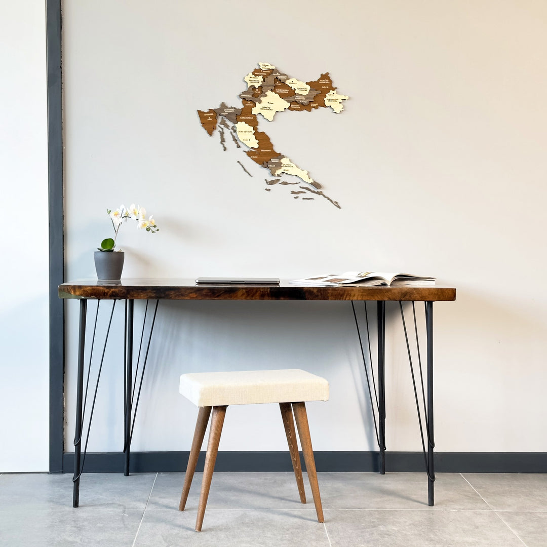 Croatia multilayered wooden wall map above a console table with iron legs and a cream stool