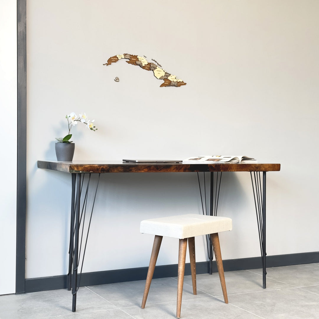 Cuba wooden wall map on a gray wall above a hairpin-leg desk