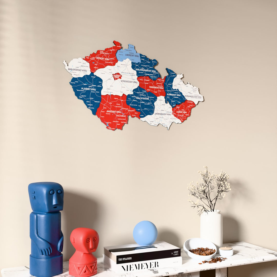 Flag colored Czech Republic wooden wall map on a beige wall above a console with figurines