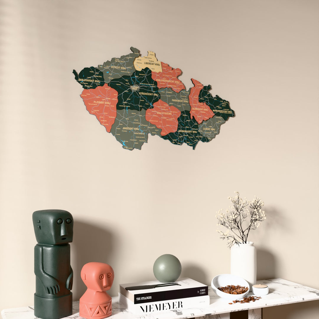 Sage Czech Republic wooden wall map on a beige wall above a console with figurines