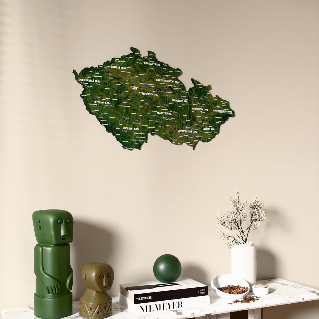 Satellite Czech Republic wooden wall map on a beige wall above a console with figurines