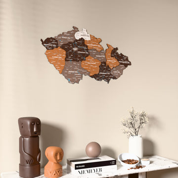 Soil Czech Republic wooden wall map on a beige wall above a console with figurines
