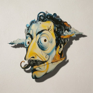 Surrealist face metal wall art on a light wall, close front view with shadow
