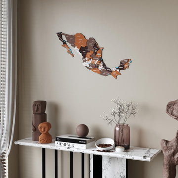 Soil Mexico wooden wall map in brown, rust and cream states above a marble console table, sheer curtain at the left