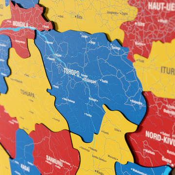 Close-up of the Flag colored Democratic Republic of the Congo wooden wall map with layered regions and printed names