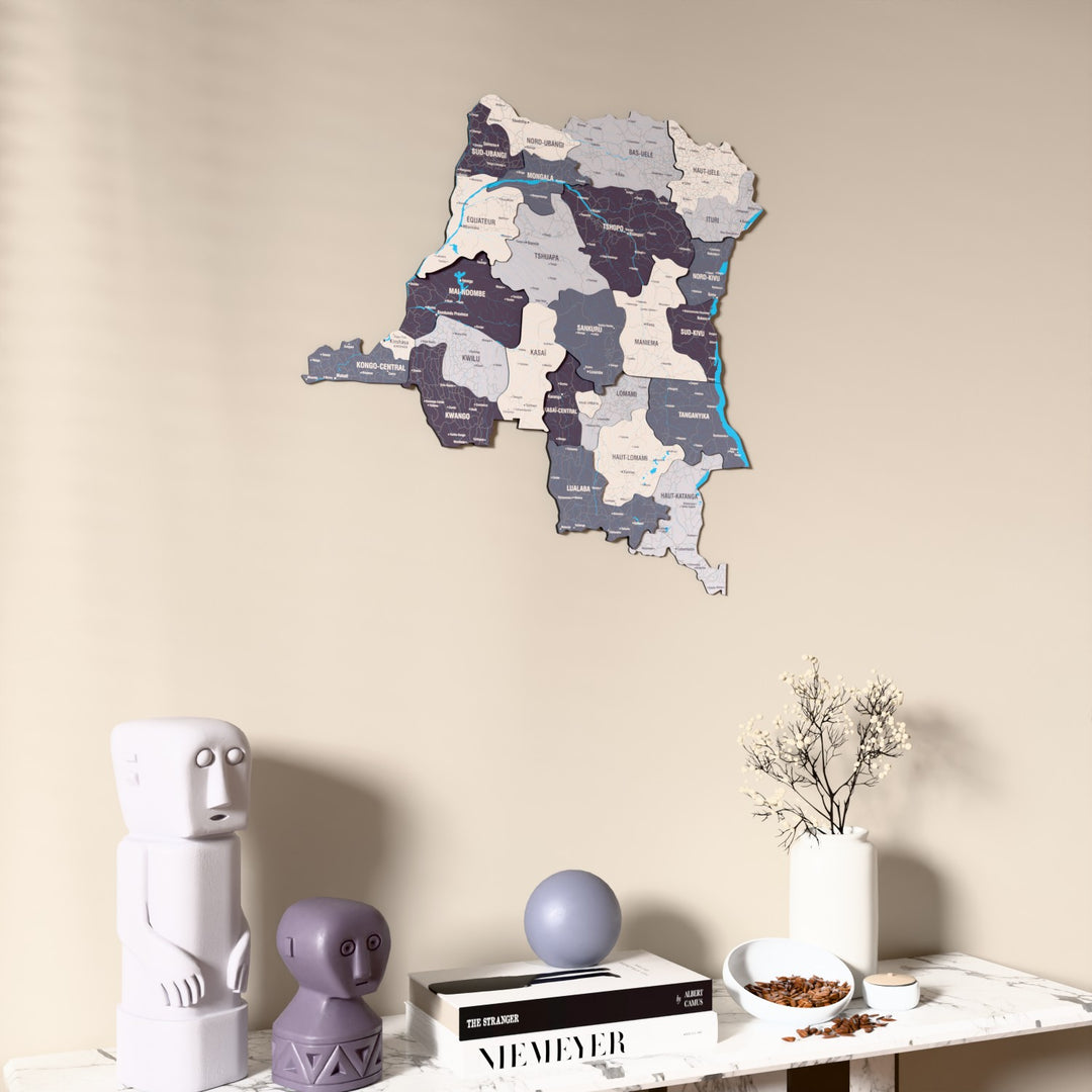 Nimbus Democratic Republic of the Congo wooden wall map on a beige wall above a console with figurines