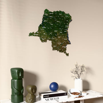 Satellite Democratic Republic of the Congo wooden wall map on a beige wall above a console with figurines