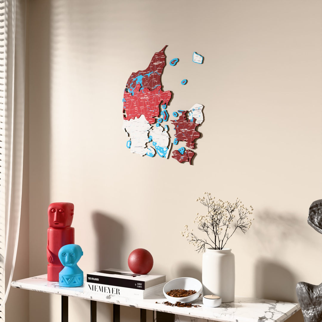 Flag colored Denmark wooden wall map beside a sheer curtain, angled view