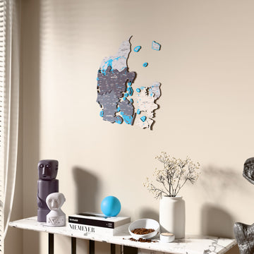 Nimbus Denmark wooden wall map beside a sheer curtain, angled view