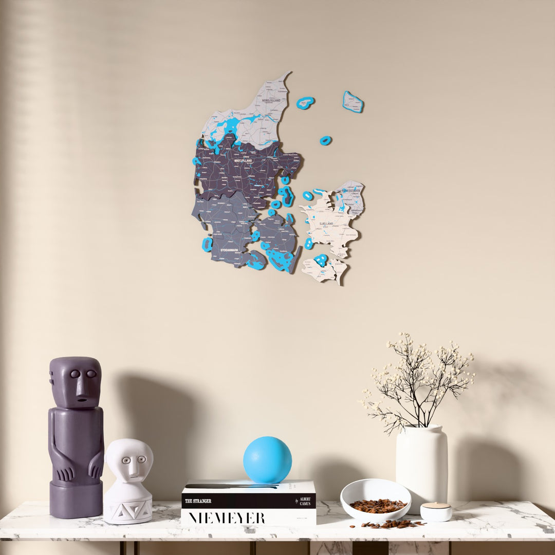 Nimbus Denmark wooden wall map above a marble console, front view