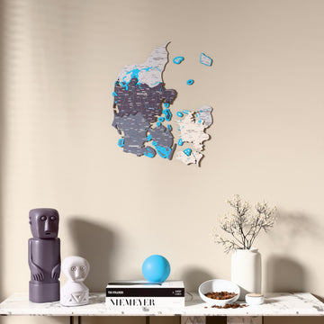 Nimbus Denmark wooden wall map above a marble console, front view