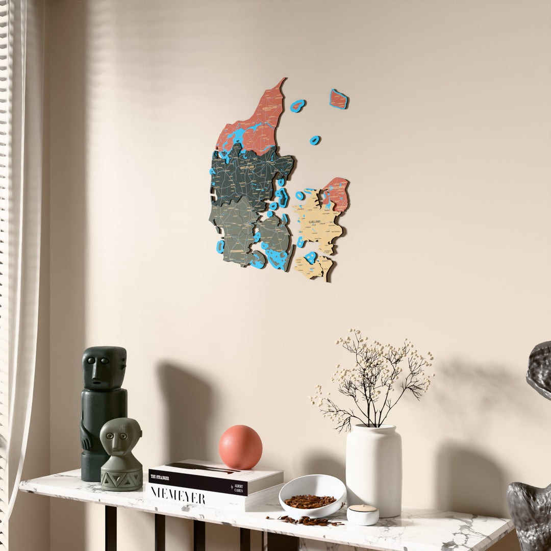 Sage Denmark wooden wall map beside a sheer curtain, angled view