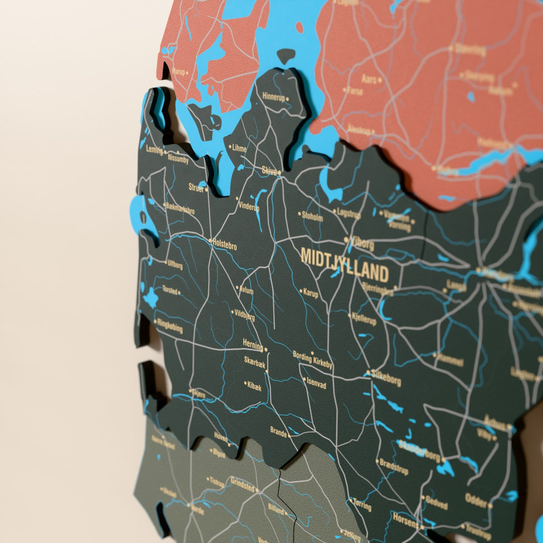 Close-up of the Sage Denmark wooden wall map with layered regions and printed names