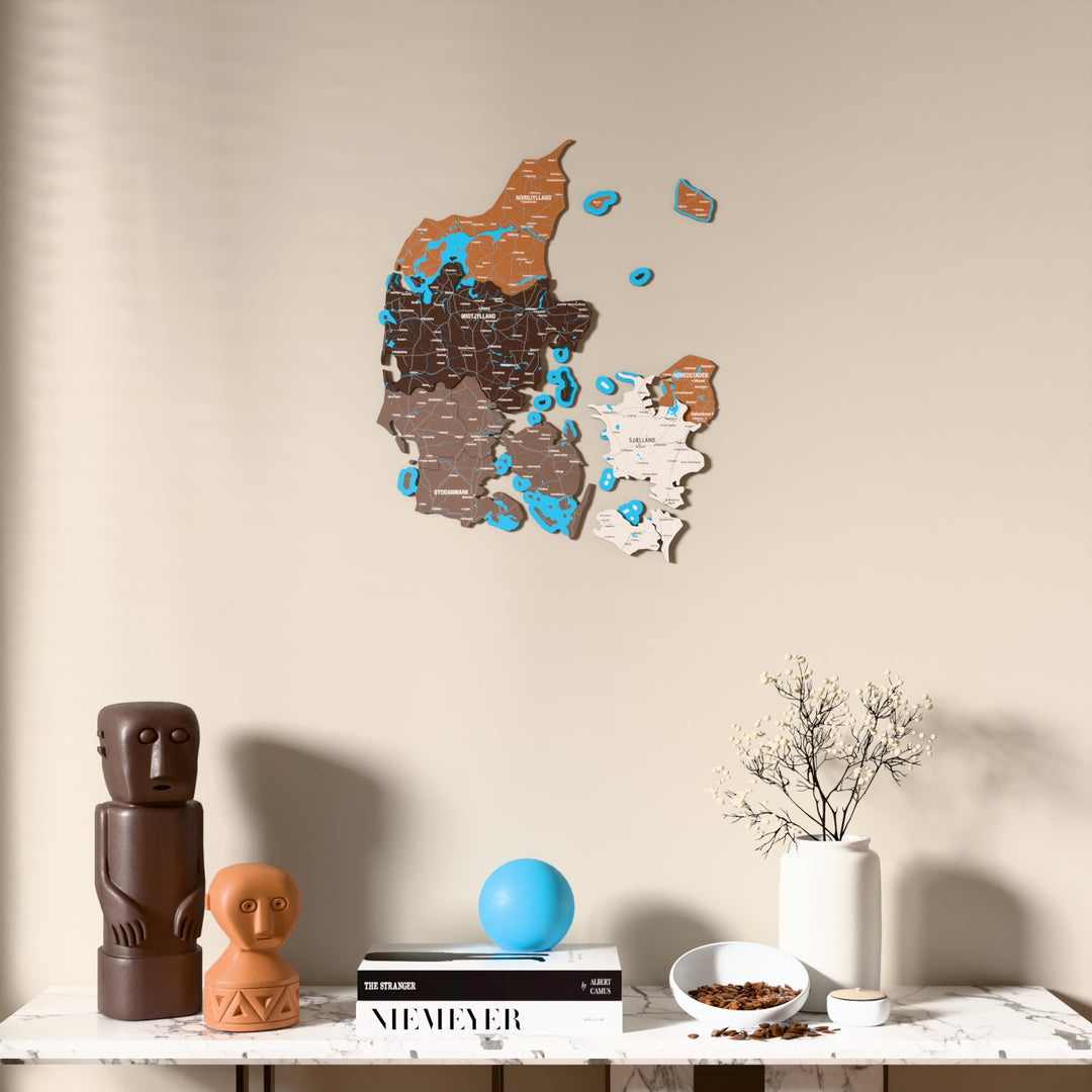 Soil Denmark wooden wall map above a marble console, front view