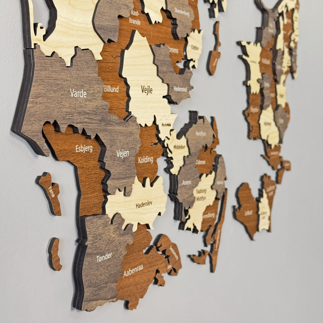 Angled close-up of the wooden Denmark map showing Varde, Esbjerg, Vejen, Kolding, Vejle and Haderslev layers