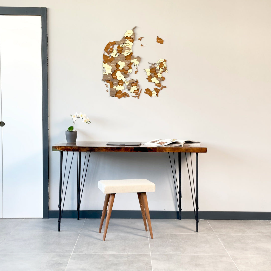 Denmark wooden wall map above a live-edge desk, wide view