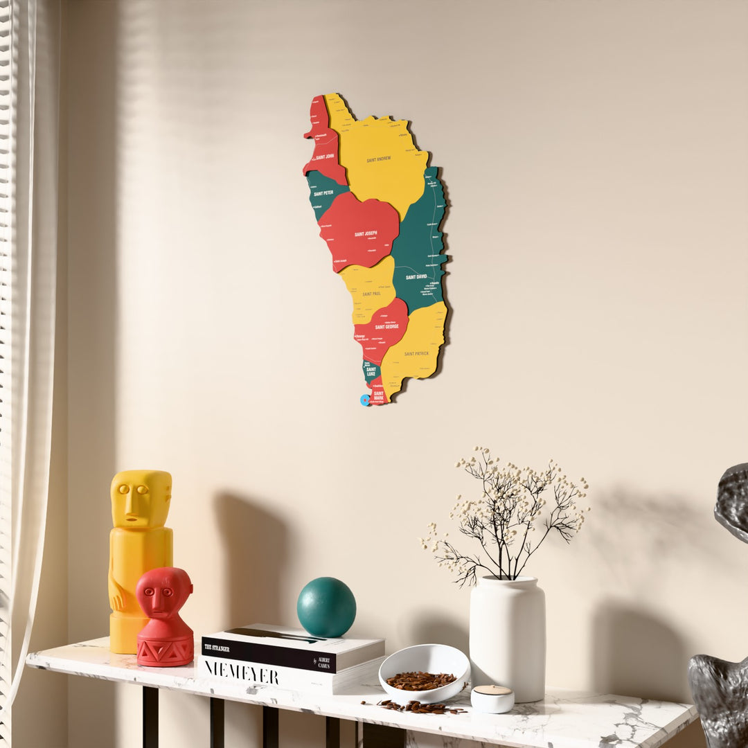 Flag colored Dominica wooden wall map beside a sheer curtain, angled view