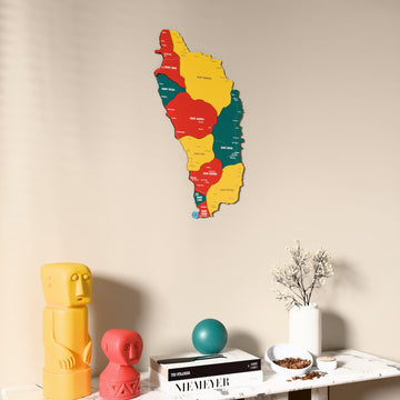 Flag colored Dominica wooden wall map on a beige wall above a console with figurines