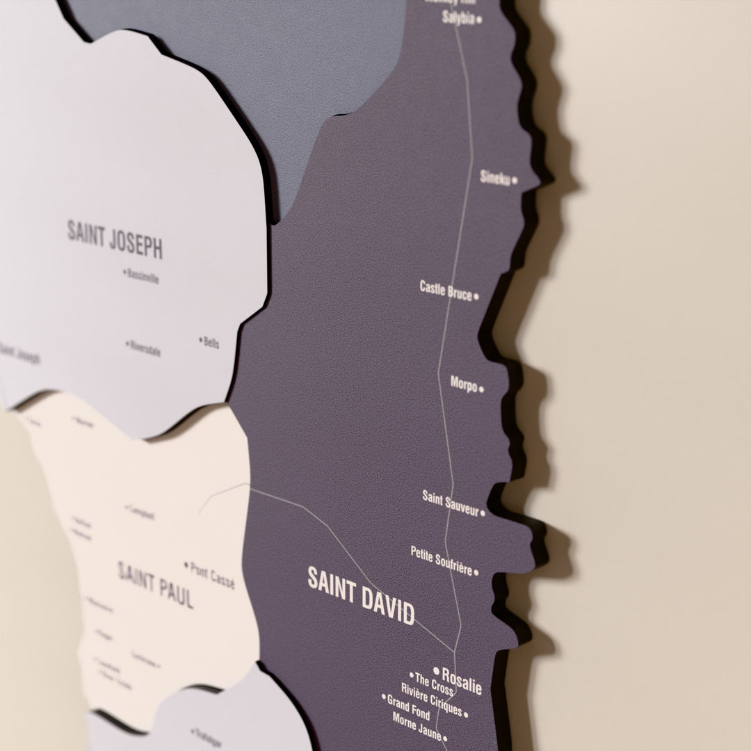 Close-up of the Nimbus Dominica wooden wall map with layered regions and printed names