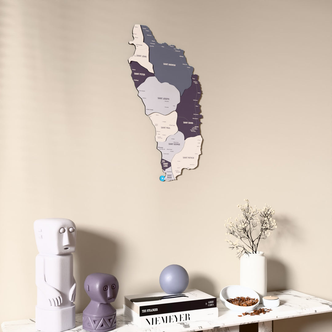 Nimbus Dominica wooden wall map on a beige wall above a console with figurines