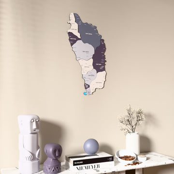 Nimbus Dominica wooden wall map on a beige wall above a console with figurines